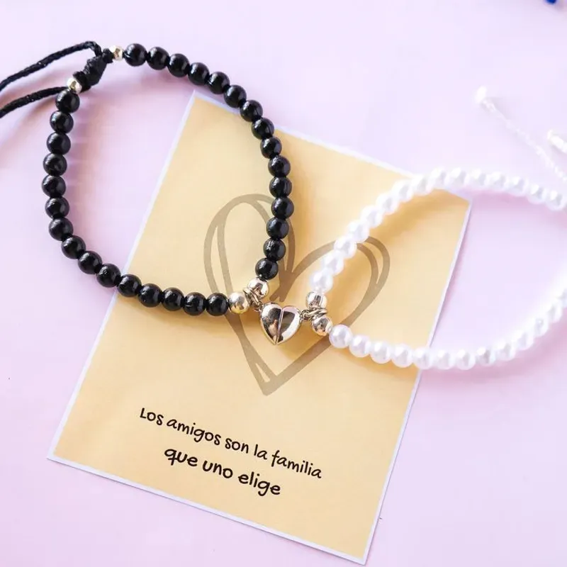 Pulseras de pareja de perlas y corazón imantado 