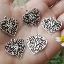 Plata antigua , forma de corazon y maripoza 