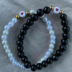 pulsera blanca y negra con corazon❤️
