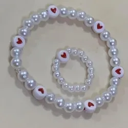pulsera y anillito de perlas blancas con corazones❤️