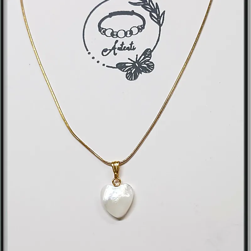 Cadena de acero con corazon nacarado