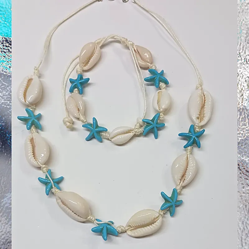 Juego de pulso de caracol y collar con estrellas azules 