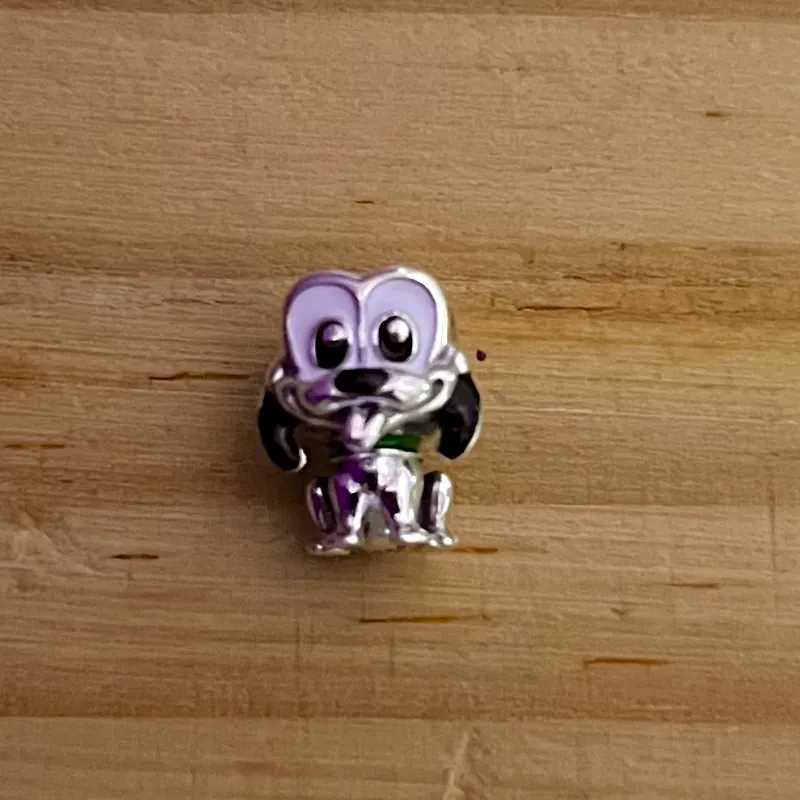 Charm de Pluto 