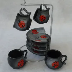 Juego de cuatro tazas y platillos 