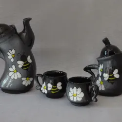 Juego de dos tazas, azucarero y tetera 