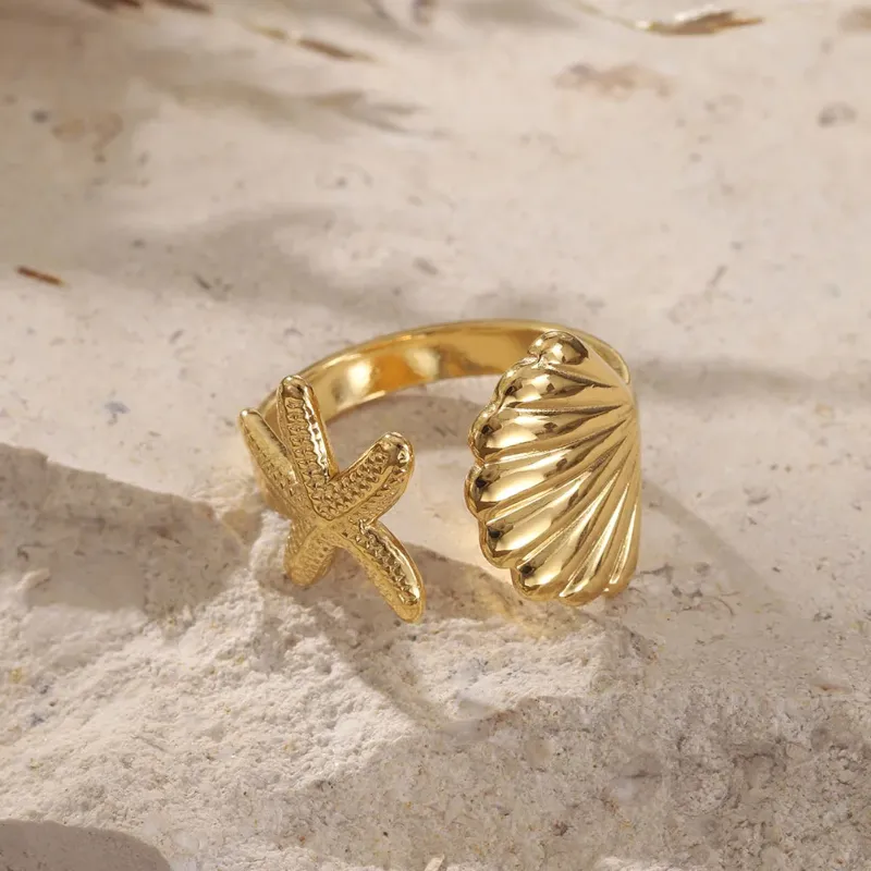 Anillo dorado estrella+concha 