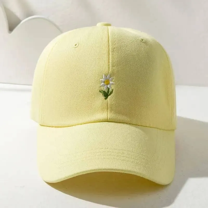 Gorra amarilla de flor 