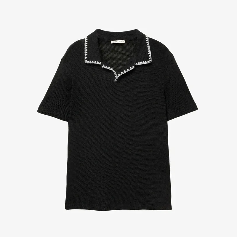 Pullover negro bordes blancos 