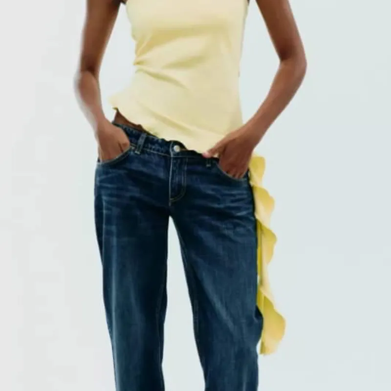 Top amarillo con fleco