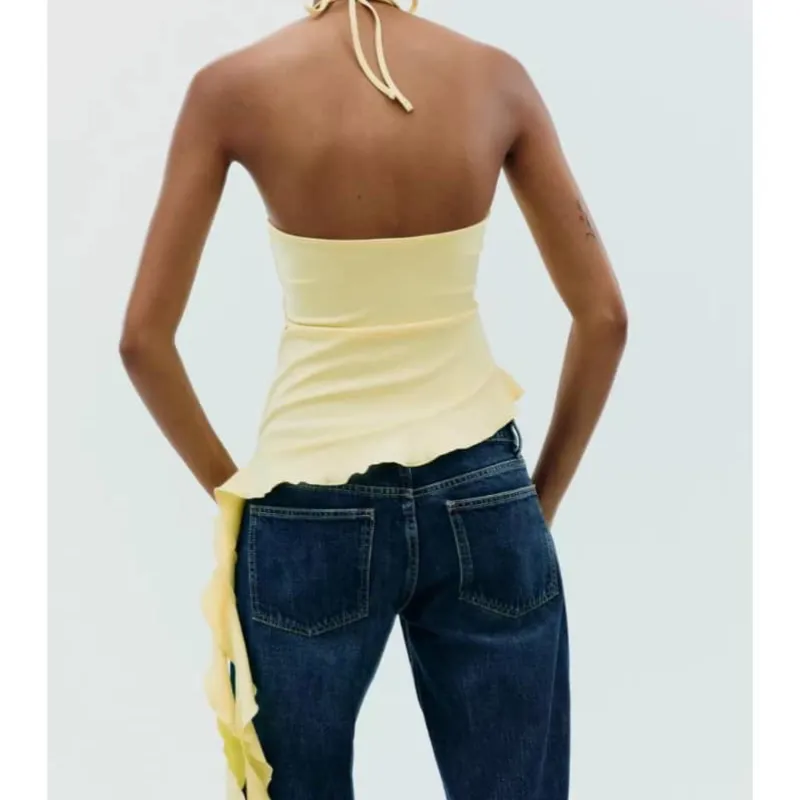 Top amarillo con fleco