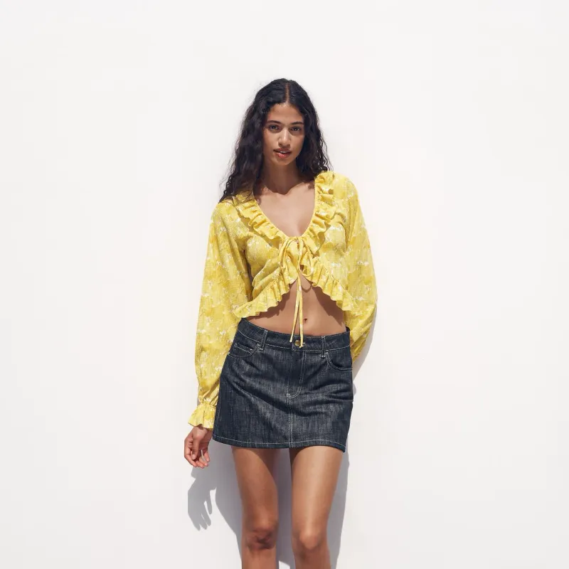 Top amarillo de flores 