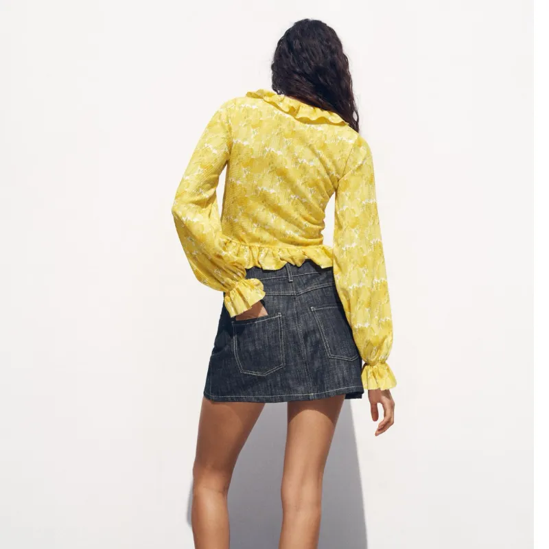 Top amarillo de flores 