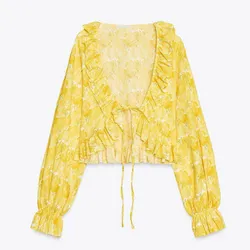 Top amarillo de flores 