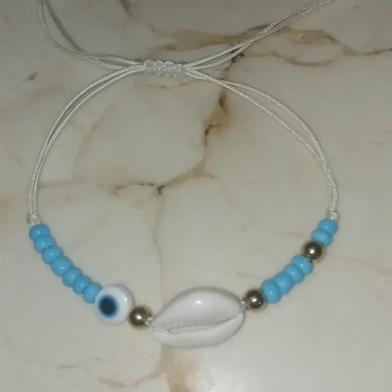 Pulsera de Caracol con Ojo Turco, Chaquirón y Cuentas de Acero 