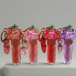Lip gloss mágico con llavero 🍇