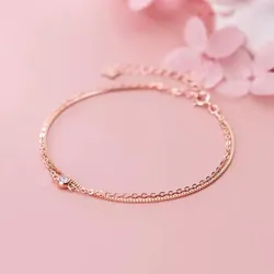 Pulsera doble de oro rosa con piedra central