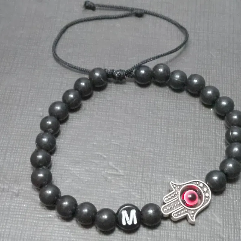 Pulso personalizado con iniciales de mano de Fátima y ojo turco