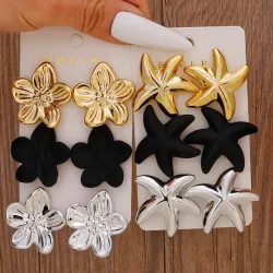 Aretes dorados, negros y plateados