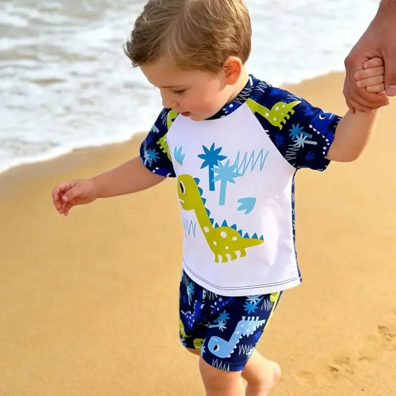 Conjunto de playa con dinosaurio