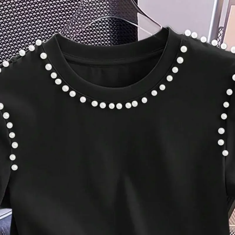 Pullover negro con perlas