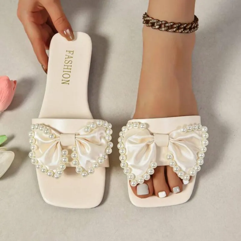 Sandalias planas con lazo