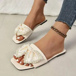 Sandalias planas con lazo