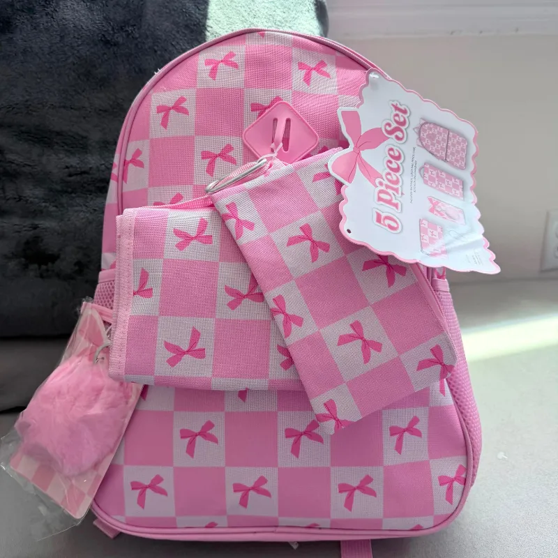 Set de mochila rosada con lazos