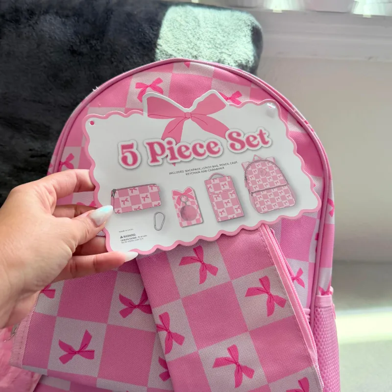 Set de mochila rosada con lazos