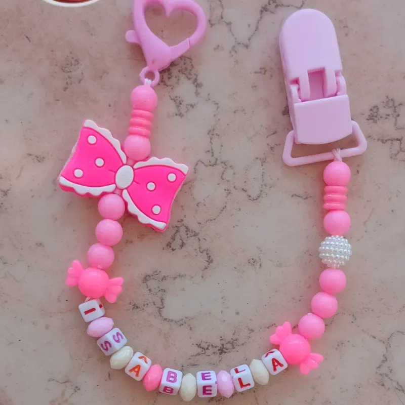 Chupetero con lazo rosa para hembra 