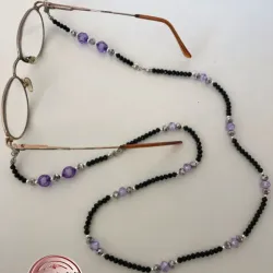 Sujetador de lentes o espejuelos 