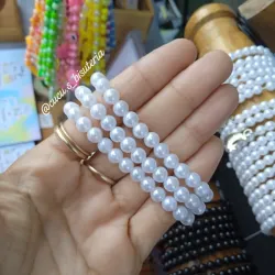 Pulsa de perlas blanca