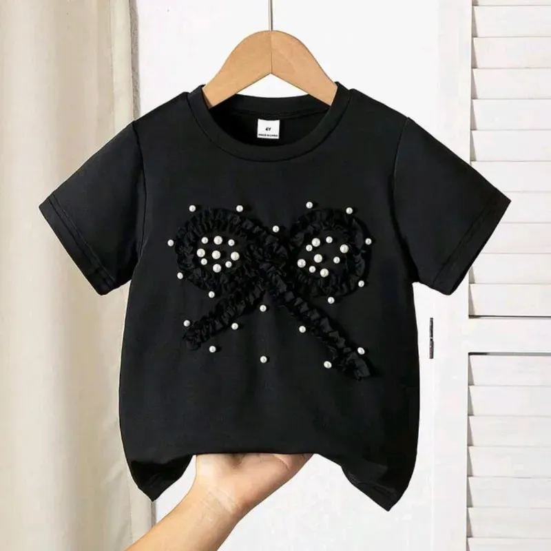 Camiseta negra con lazo perlas