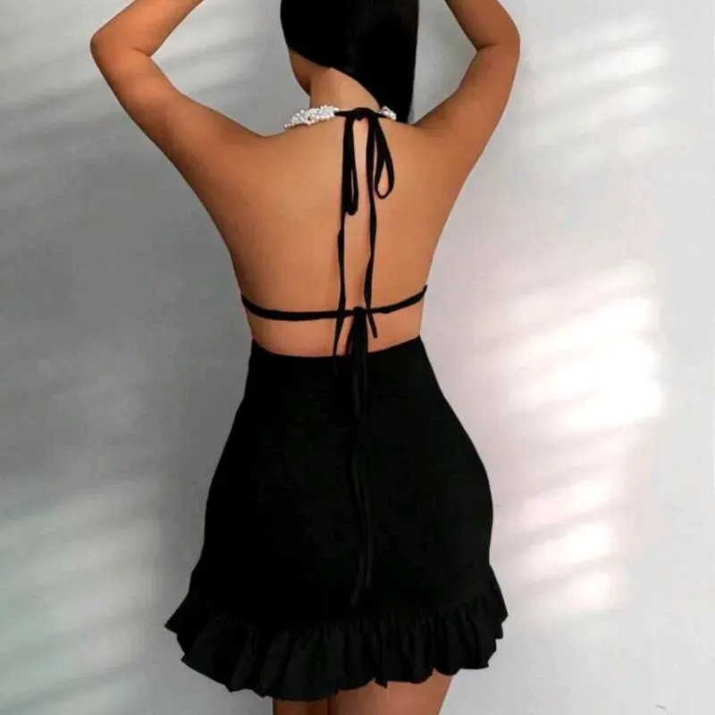 Vestido negro espalda afuera y vuelo