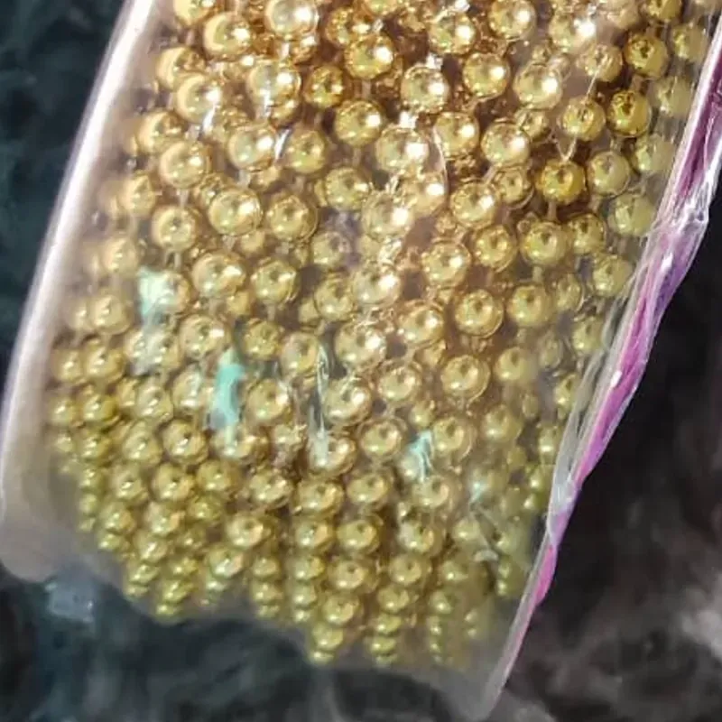 Tira perlas doradas