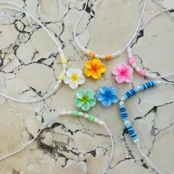 Collar con dije de flor 🌺 , perlas de río y fimos