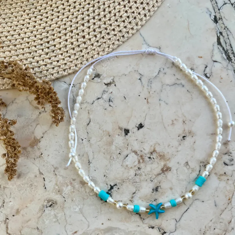 Collar con perlas de río , fimos y estrellas d mar 
