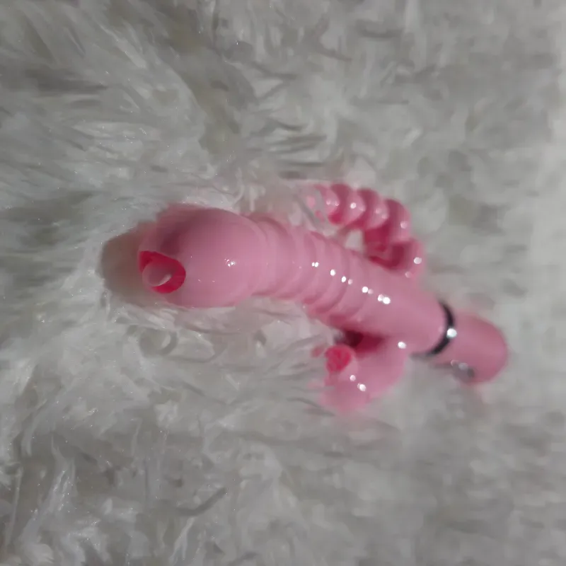 Vibrador rosado con lenguita giratorio