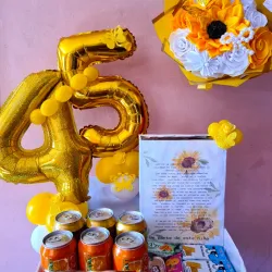 Regalo con dulce y ramo de flores 