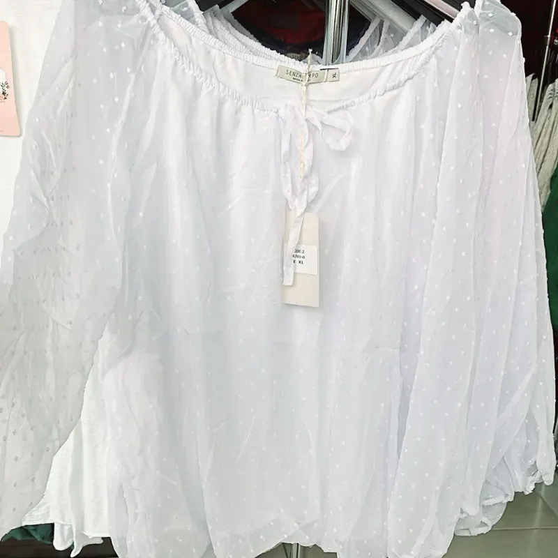 Blusa manga larga escote redondo tejido fino con forro y transparencias