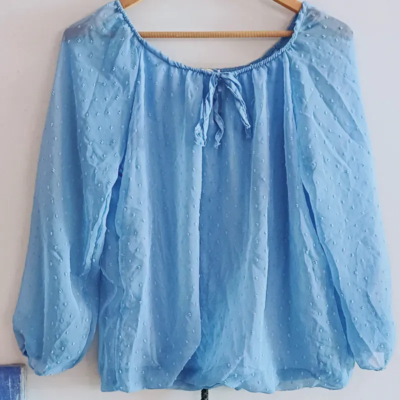 Blusa manga larga escote redondo tejido fino con forro y transparencias