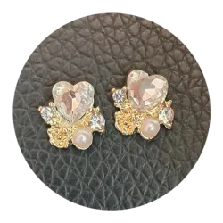 Joya dorada corazón plateado