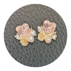 Joya dorada corazón rosa