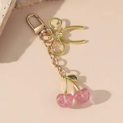 Llavero de Cherry rosa & dorado con lazo