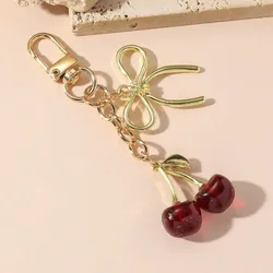 Llavero de Cherry rojo & dorado con lazo