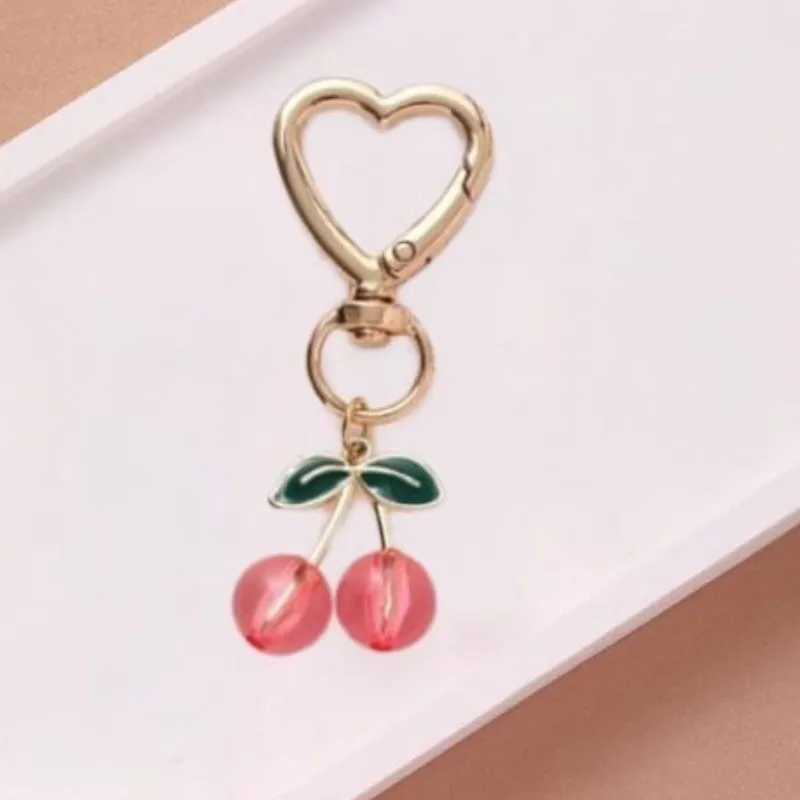 Llavero de Cherry rosa y dorado pequeño 
