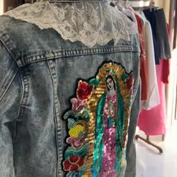 Chaqueta con virgen y encajes