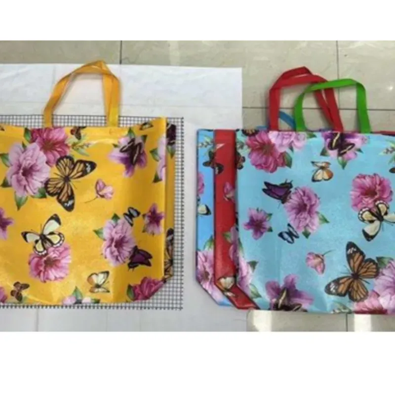  Bolsas no tejidas,  48 × 40 × 12, 95 gramos de tela no tejida de  material nuevo, 105 gramos de producto  terminado  12 us mezcladas / OPP