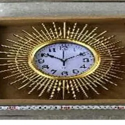  Reloj de pared dorado con diseño de sol plástico,  26 cm,  Caja de cartón 