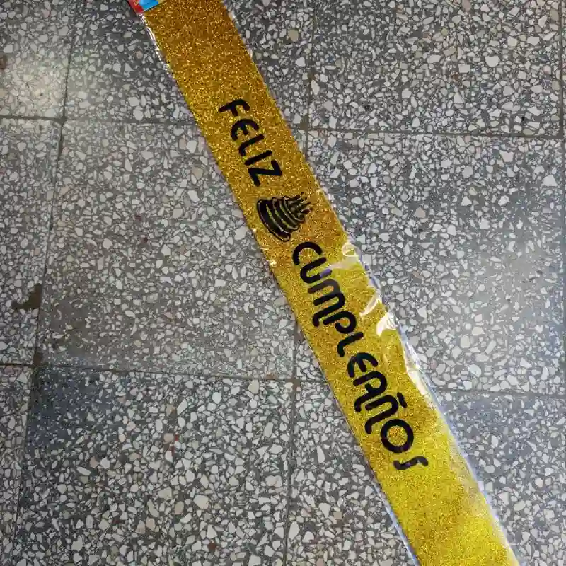 Banda feliz cumpleaños dorada escarchada 