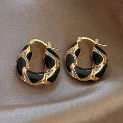 Aretes negros y dorados